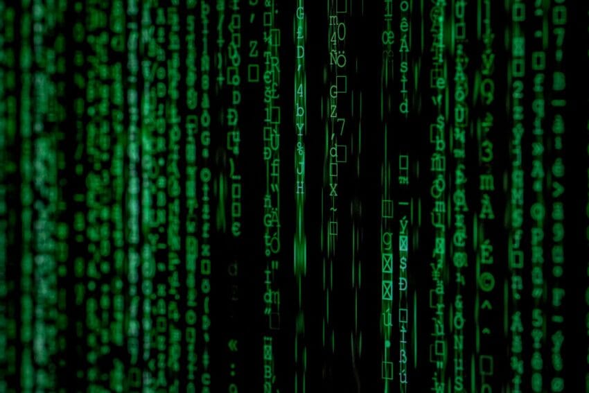 Green digital code streams on a black background